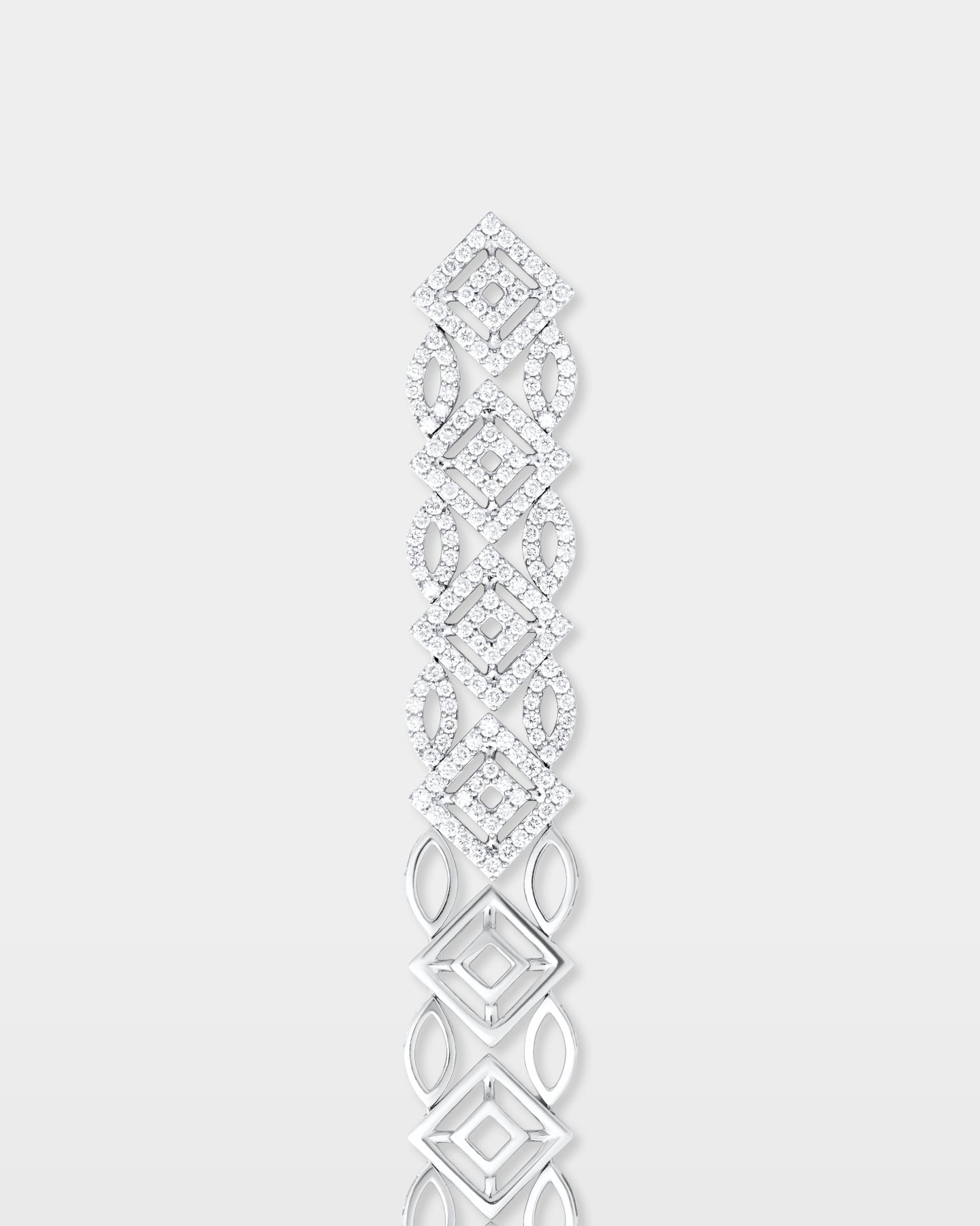 A top-down view of an articulated wide geometric pavé diamond bracelet highlighting the hidden box clasp closure