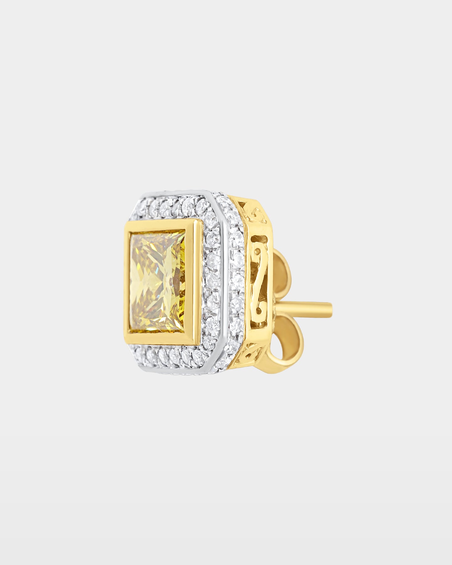 angled studio macro shot of a single two-tone canary yellow princess-cut diamond halo earring with a detailed side gallery view