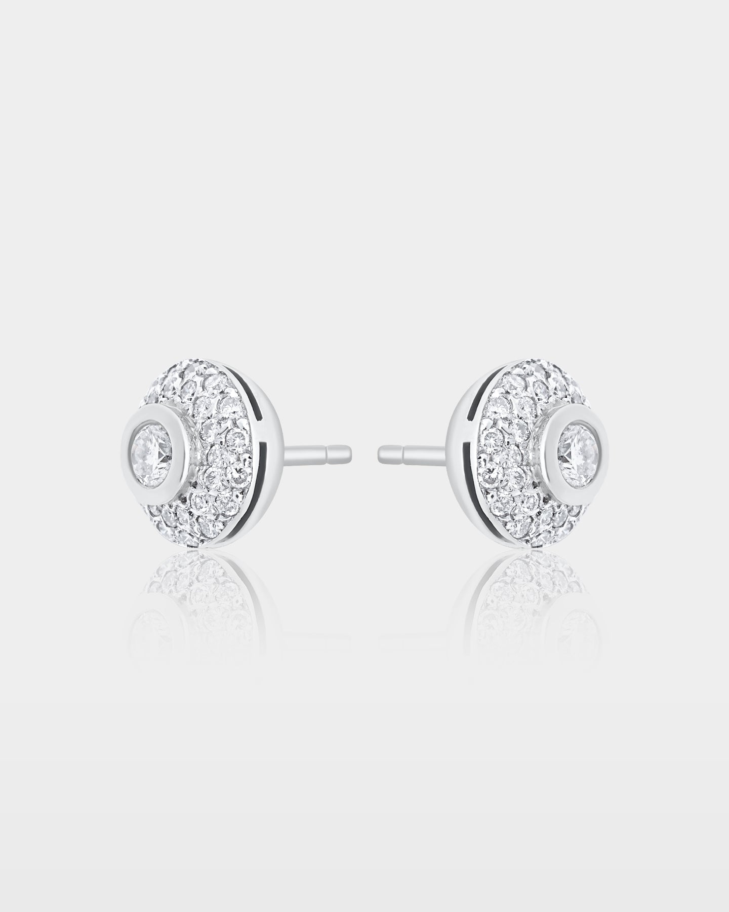 Side and reverse studio profile view of white gold round dome pave diamond stud earrings showing the metal posts