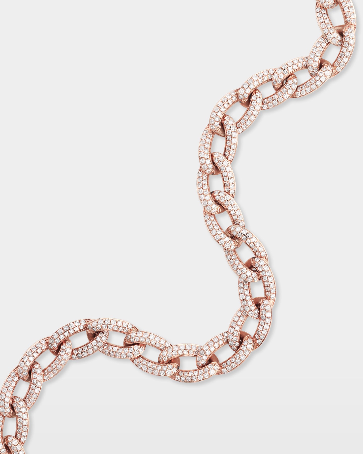 S-curve studio view showcasing the fluid link articulation and detailed stone setting of a rose gold diamond Cuban link bracelet