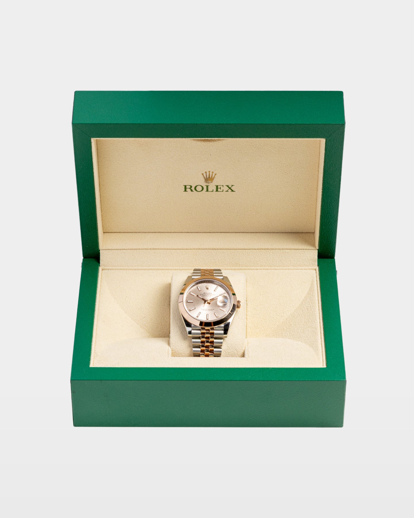 open classic green wave-motif Rolex luxury watch presentation box displaying a Sundust dial two-tone Datejust 41 inside