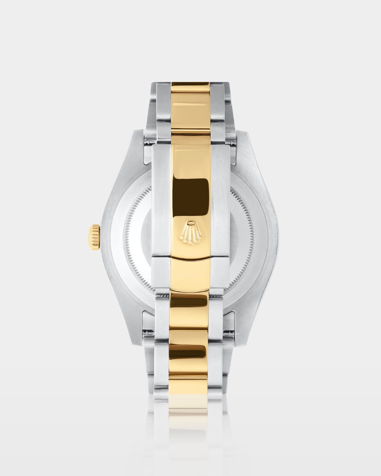 reverse view of a two-tone Rolex Datejust II watch showing the brushed steel caseback and yellow Rolesor Oyster bracelet clasp