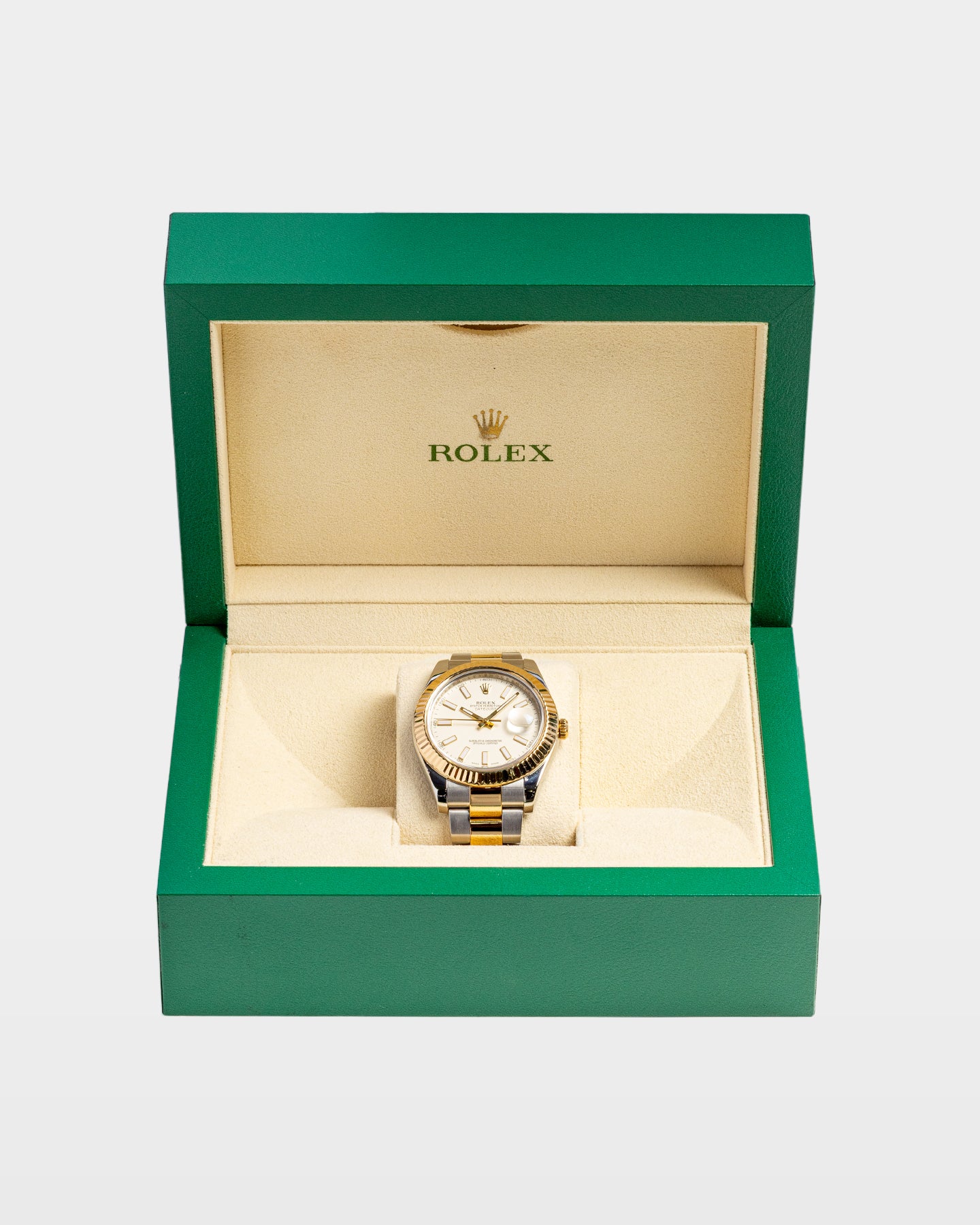 open classic green wave-motif Rolex watch presentation box cleanly displaying a two-tone white dial Datejust II inside