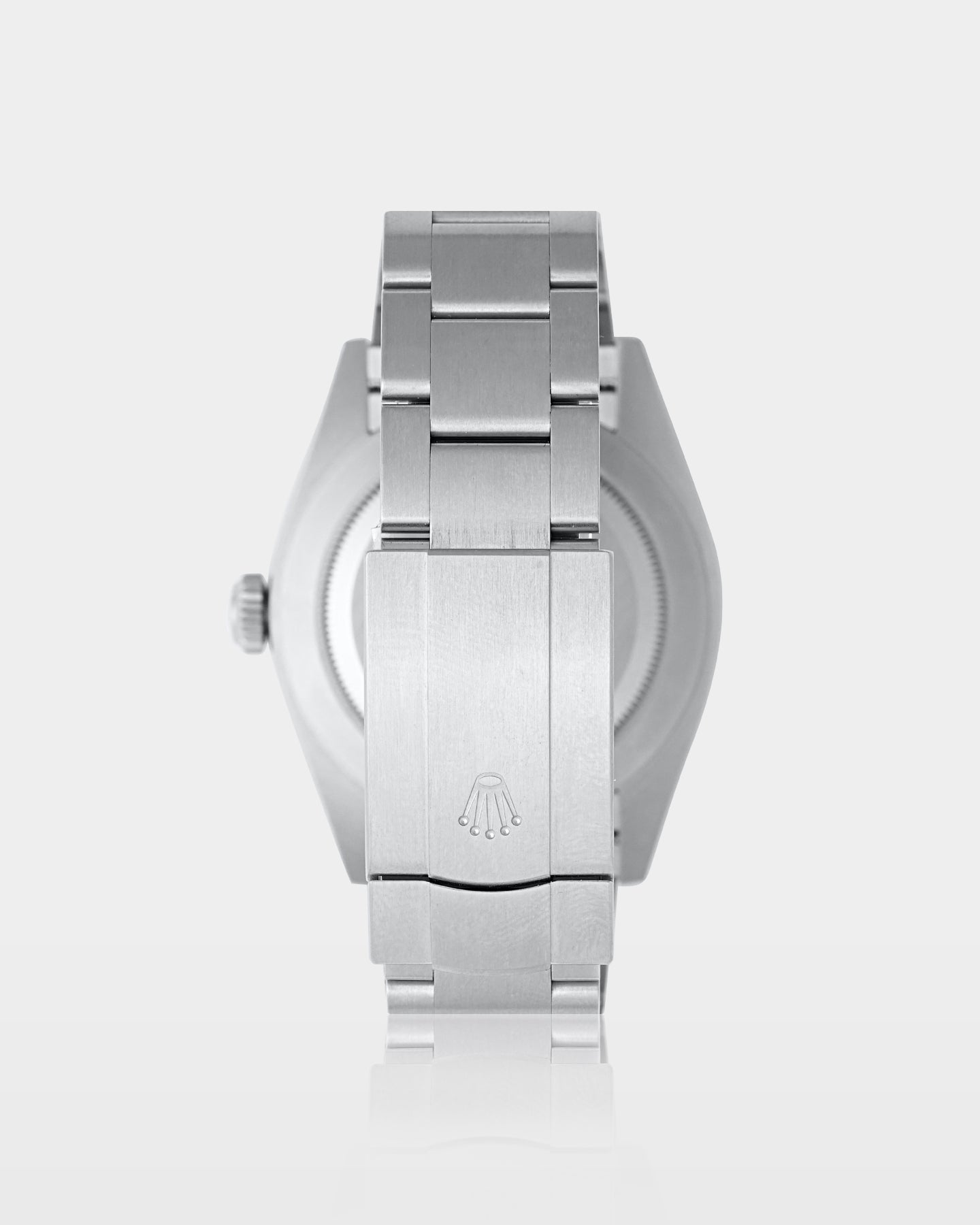 reverse studio view of a Rolex Oyster Perpetual showing the brushed Oystersteel caseback and folding Oysterclasp
