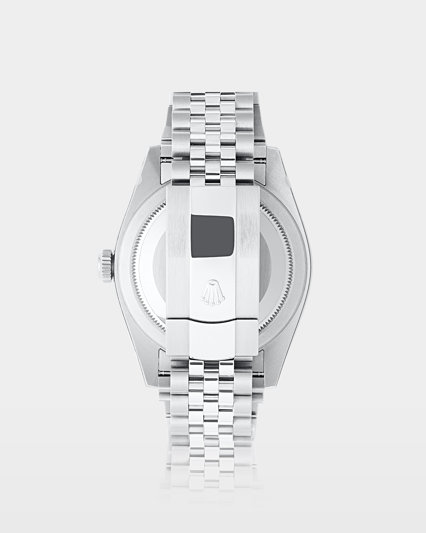 reverse view of a Rolex Sky-Dweller watch showing the brushed steel caseback and an Oystersteel folding Oysterclasp on a Jubilee bracelet
