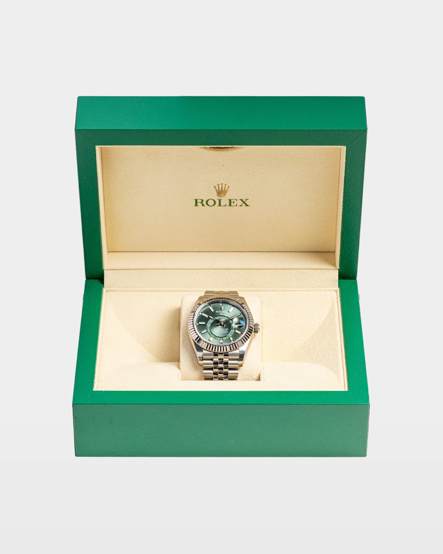 open classic green wave-motif Rolex luxury watch presentation box displaying a mint green dial Sky-Dweller 336934 inside