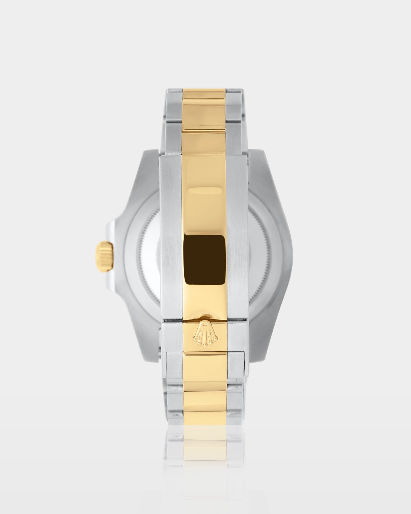reverse studio view of a two-tone Rolex Submariner showing the brushed caseback and yellow gold center-link Oysterlock clasp